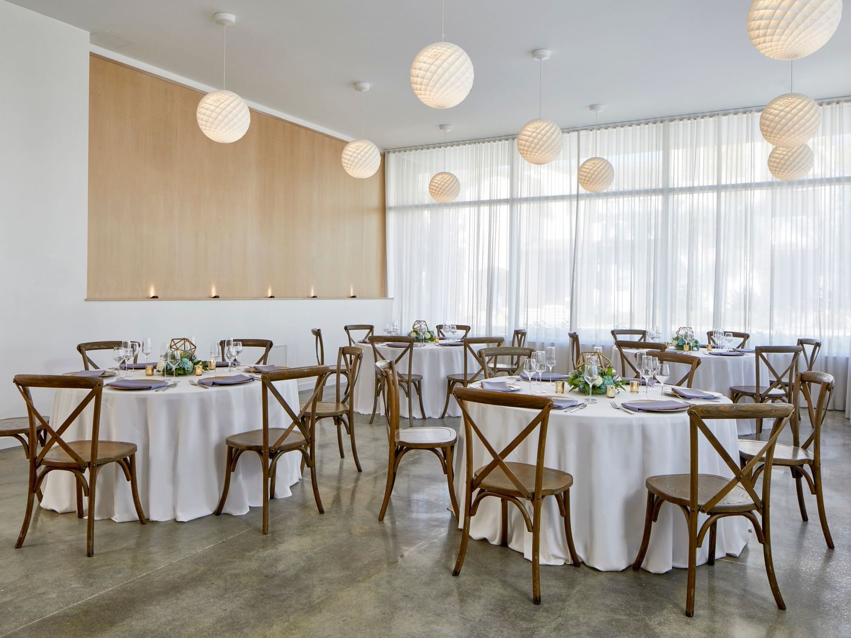 Banquet tables setup in The Gallery Room at The Sarasota Modern