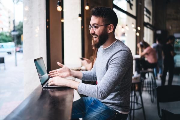 Happy worker with improved employee morale due to remote working option