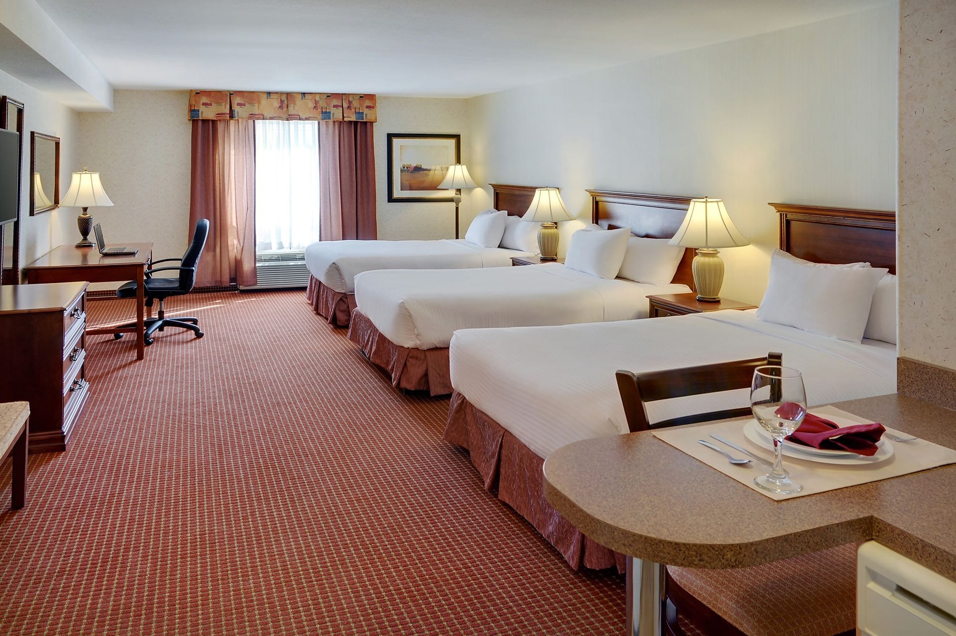 Grimshaw Hotel room with Three double beds