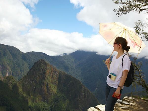 A tourist in Machu Picchu mountains