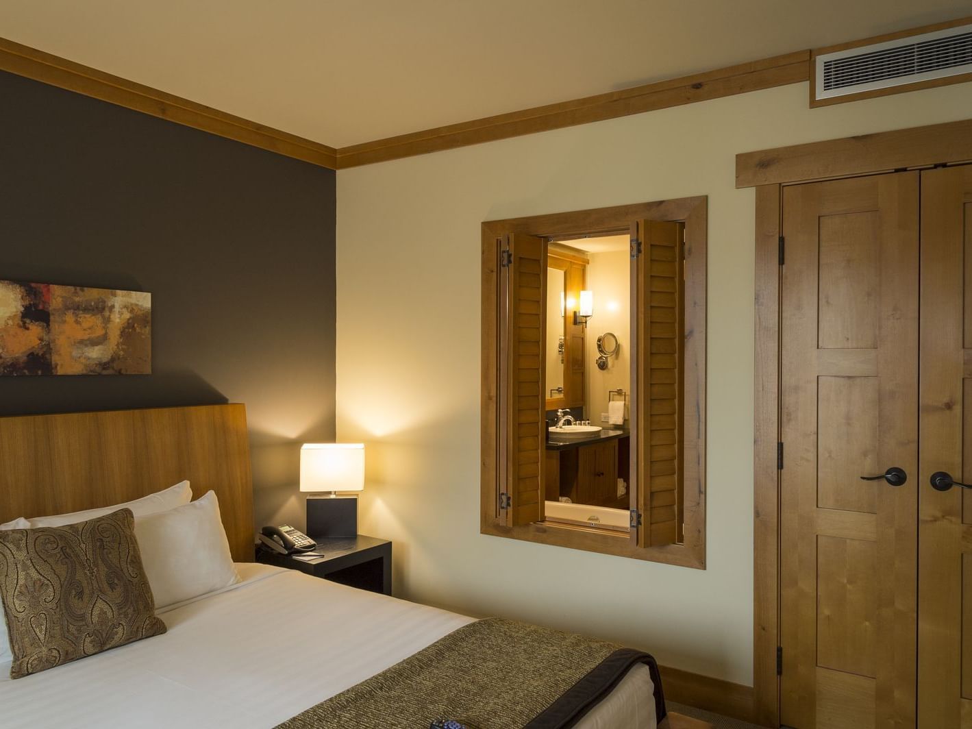 Bed with headboard in Two Bedroom Nita Suite at Nita Lake Lodge