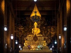 An idol of Buddha at Wat Pho near Emporium suites by Chatrium