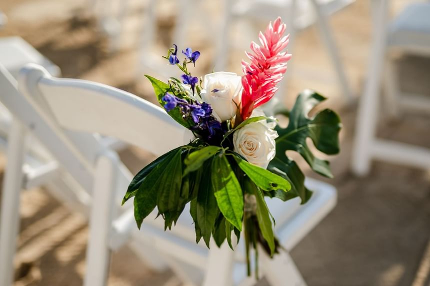 Flower decoration on a chair at the wedding venue at Hotel Isla Del Encanto