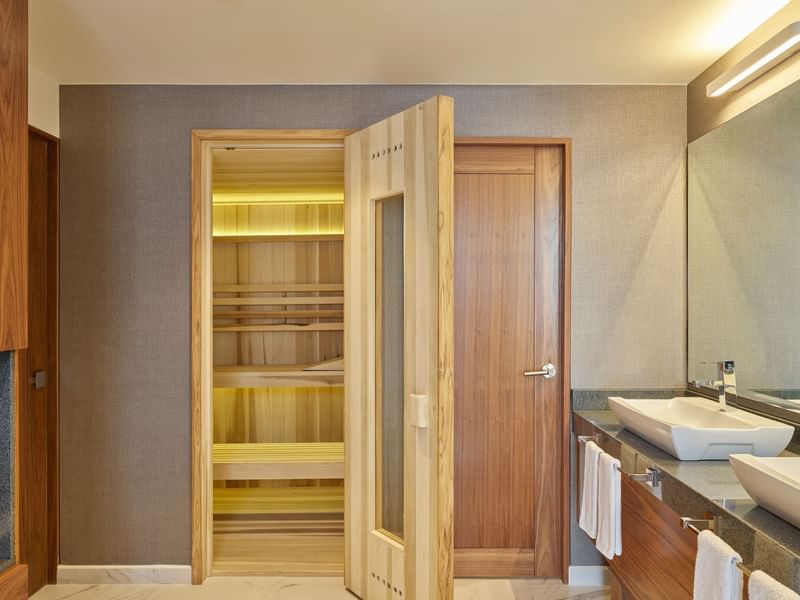 Bathroom vanity & wooden closet in Presidential Suite at Fiesta Americana