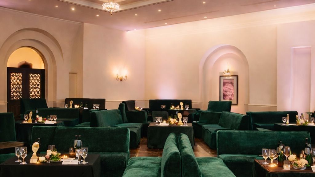 Sophisticated lounge area featuring plush green velvet seating and ambient lighting at Serena Hotels & Resorts