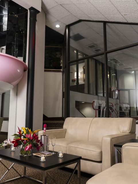 Interior of the Champagne Tower living room area with a bathtub at Cove Pocono Resorts