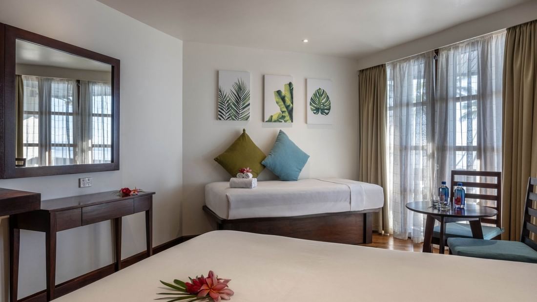 Elegant Ocean View Room with twin beds, tropical decor, and scenic windows at Warwick Fiji Resort and Spa in Korolevu.