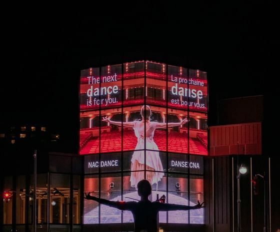A Lady in front of the National Arts Center near ReStays Ottawa