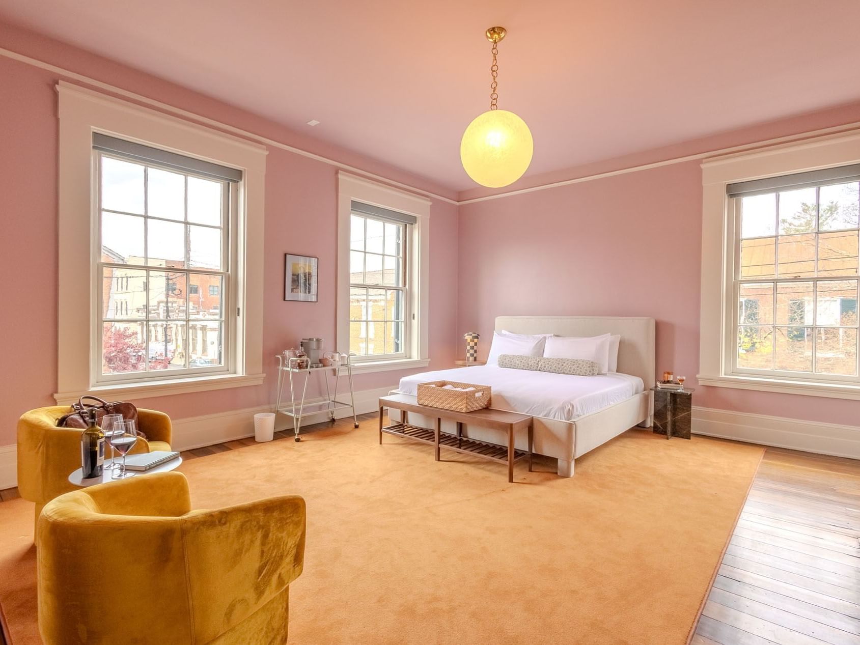 Seating area by the bed in Luxury King room at The Ashbrook Hotel, featuring Frankfort Kentucky accommodations.