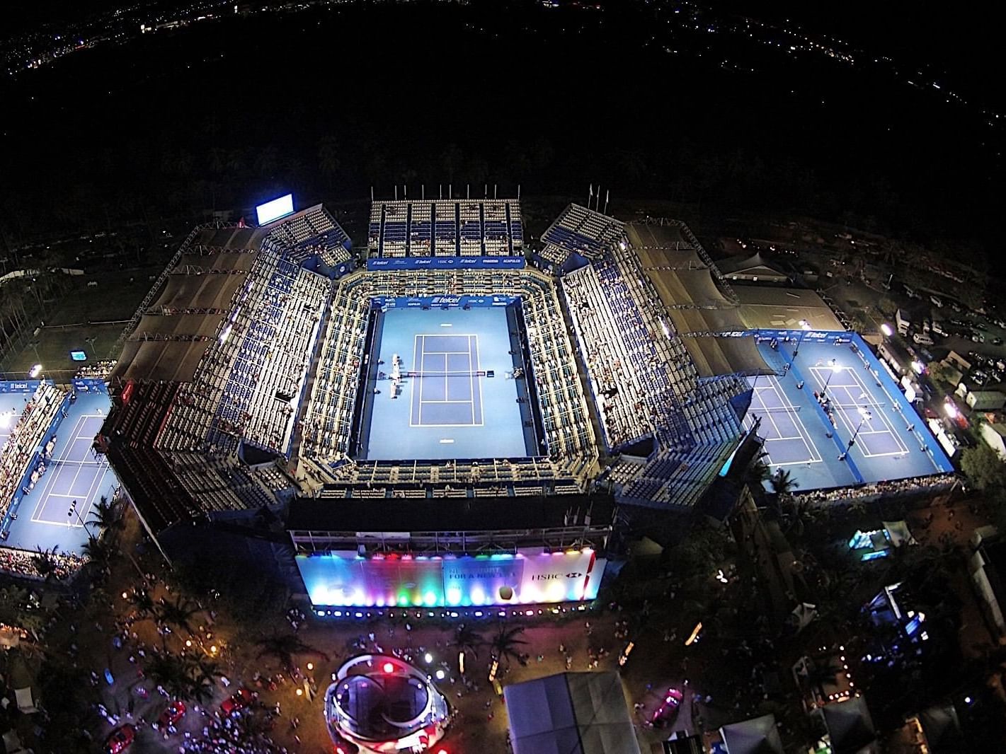 Evening aerial view tennis courts at Mundo Imperial