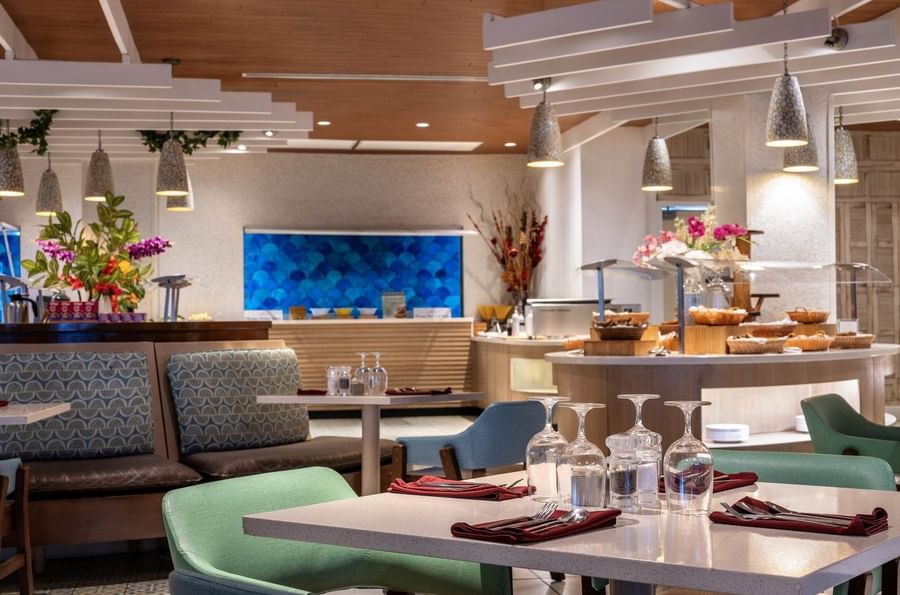 Buffet area with bread baskets by a blue scale-pattern wall in Verandah at Warwick Paradise Island Bahamas