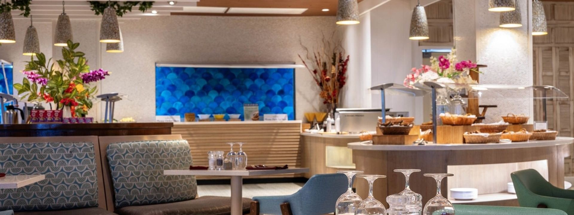 Buffet area with bread baskets by a blue scale-pattern wall in Verandah at Warwick Paradise Island Bahamas