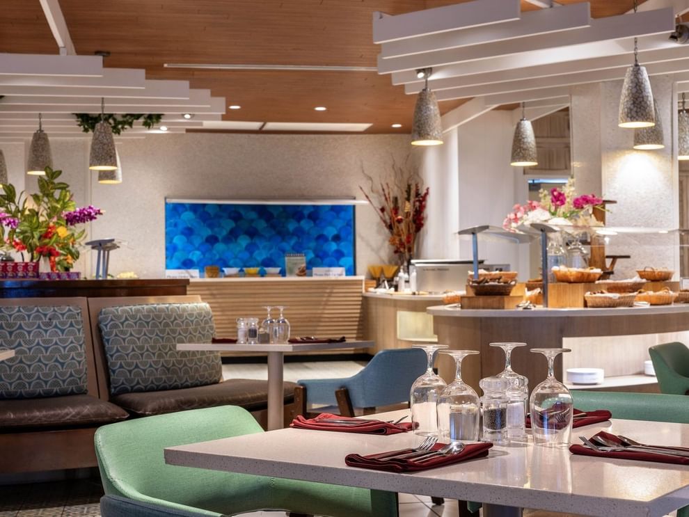Buffet area with bread baskets by a blue scale-pattern wall in Verandah at Warwick Paradise Island Bahamas