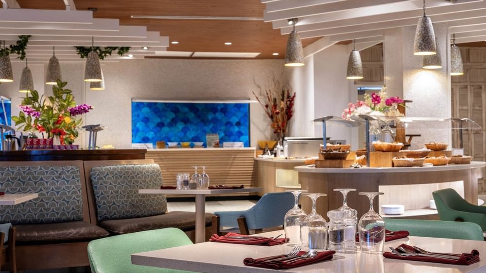 Buffet area with bread baskets by a blue scale-pattern wall in Verandah at Warwick Paradise Island Bahamas