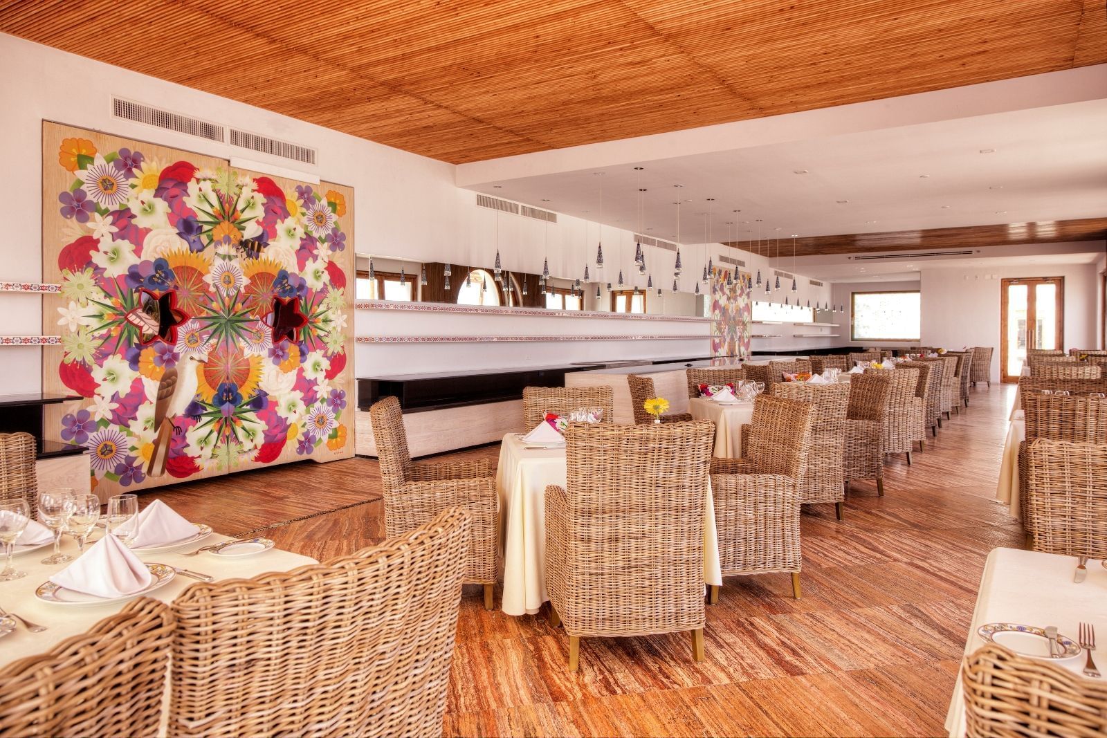 Tables and chairs in a dining area at Marquis Los Cabos