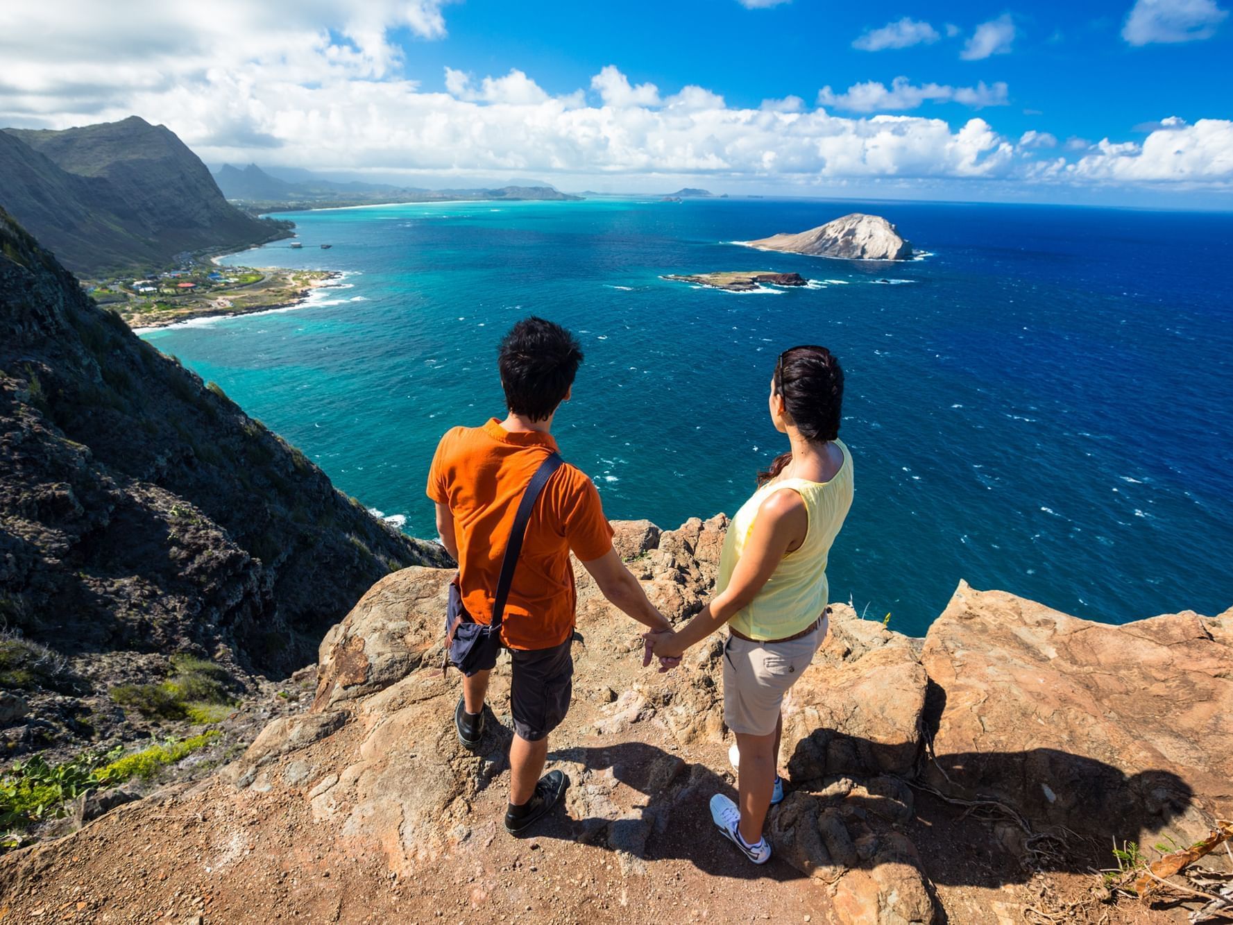 Couple overlooking the sea from a hiking view point near Paradise Bay Resort