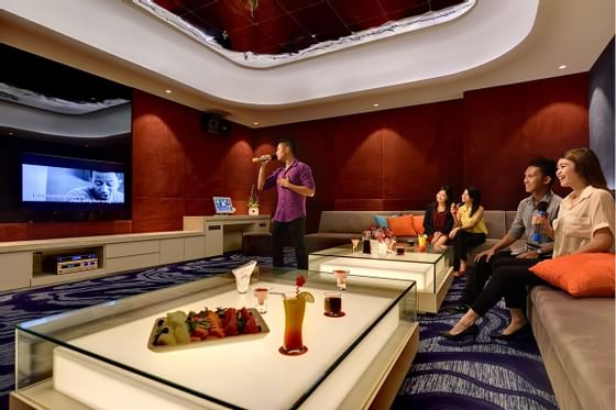 A group of people having a karaoke session - Lexis Hibiscus