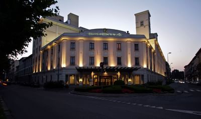 Exterior view of the Hotel with canopy, outdoor lights & sign featuring Grand Visconti Palace