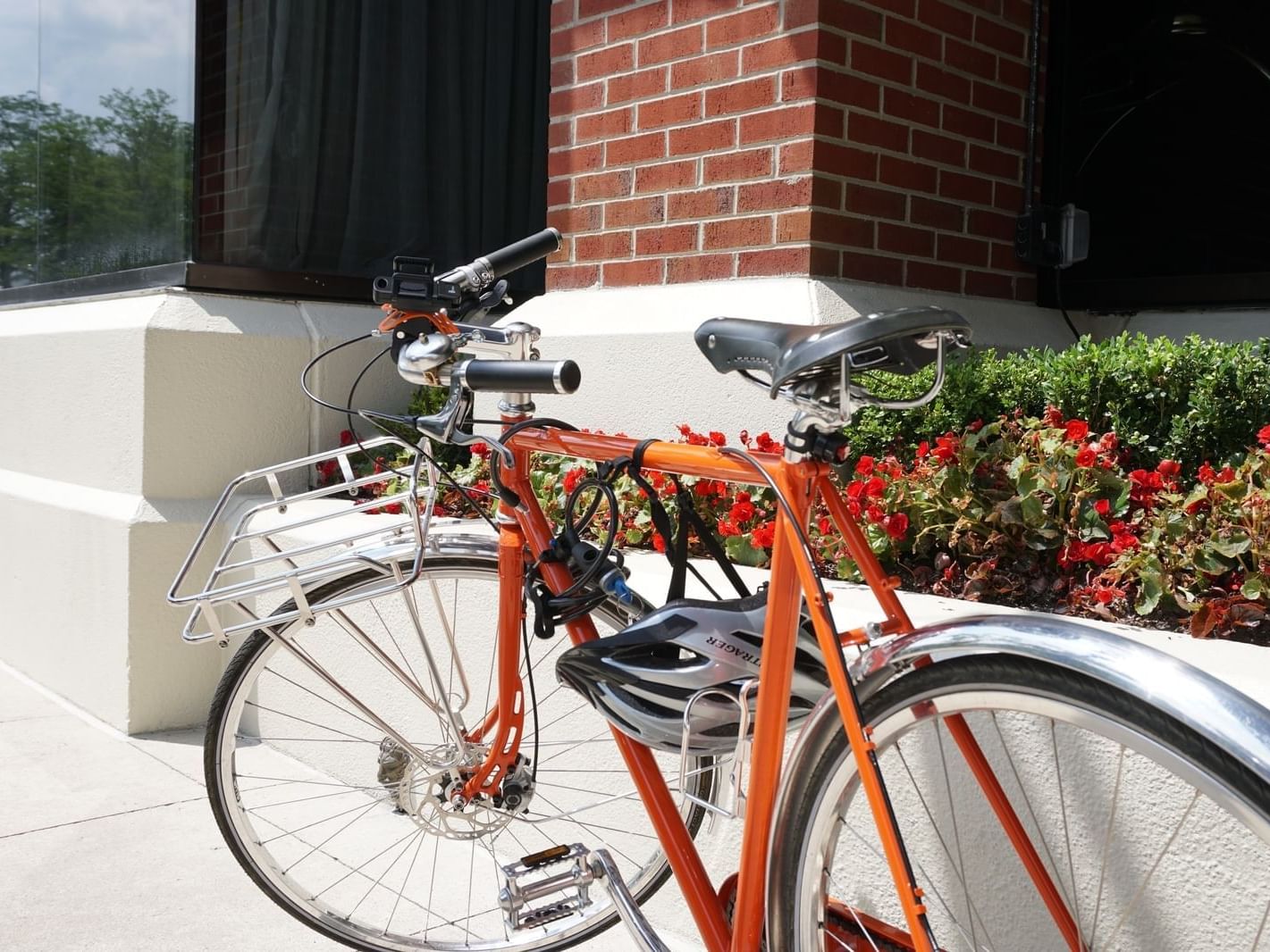 A red bicycle on a sidewalk