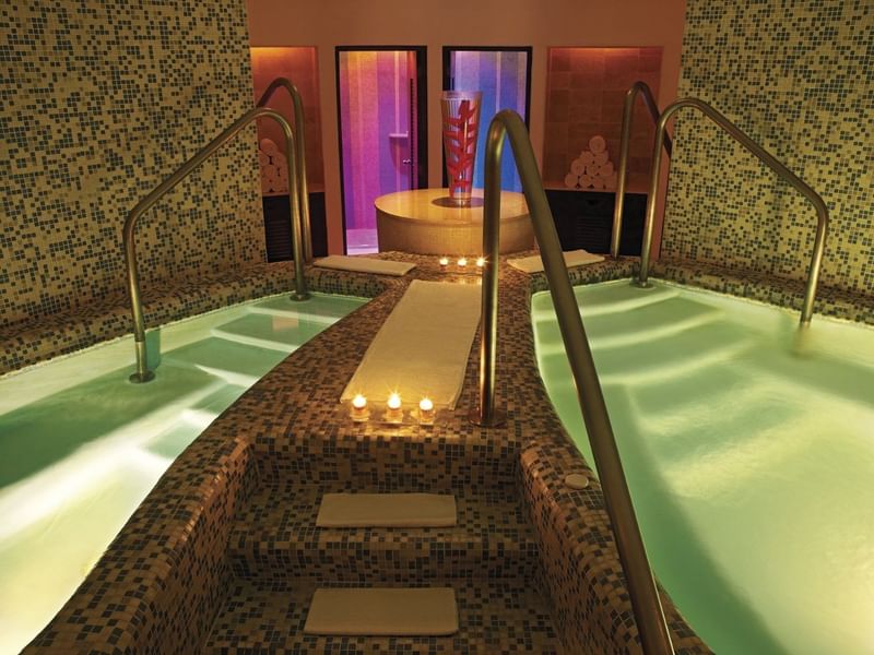 An indoor pool area in a Spa at Live Aqua Resorts