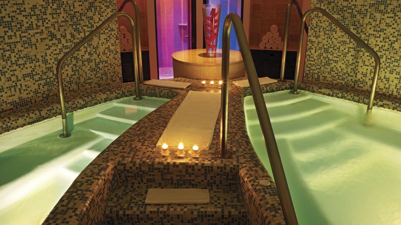An indoor pool area in a Spa at Live Aqua Resorts