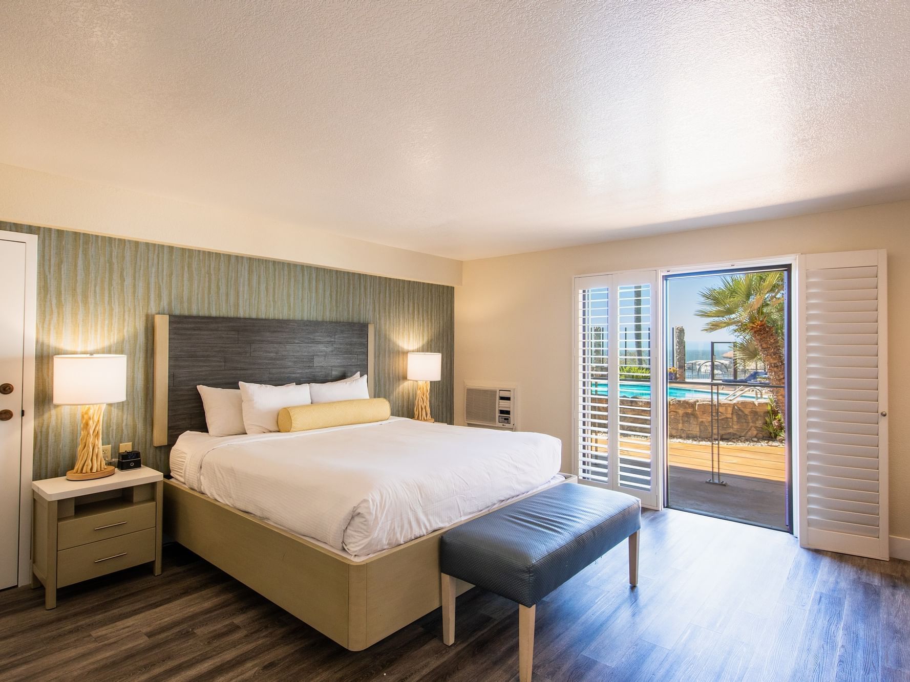Oceanview Poolside King Accessible room with bed and outside access
