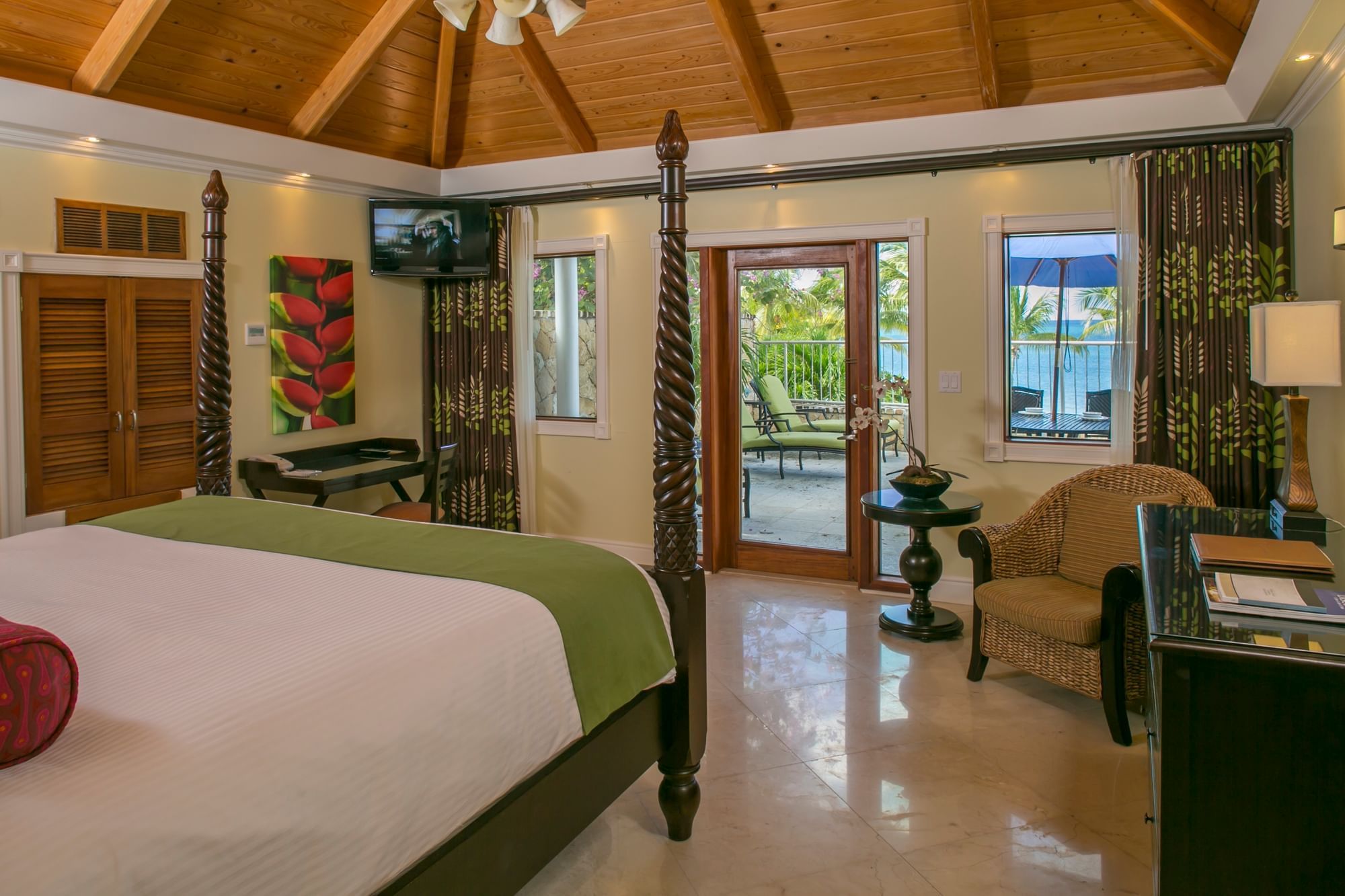 Comfy bed, lounger & furniture in Ficus Suite at The Buccaneer Resort St. Croix