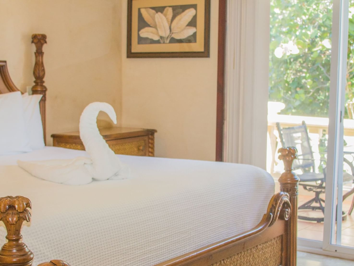 Towel swan on a bed in Two-Bedroom Garden View at Infinity Bay