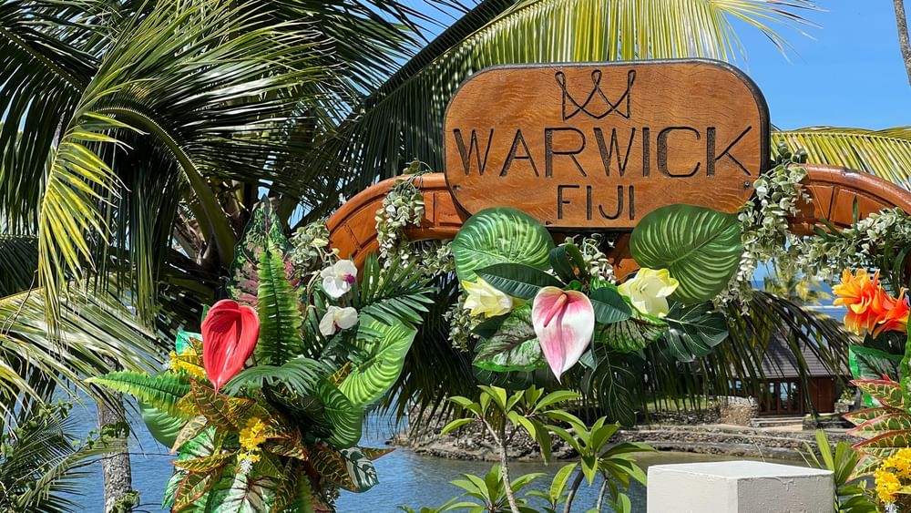 Tropical entrance decorated with flowers and greenery at Warwick Fiji Resort and Spa in Korolevu.