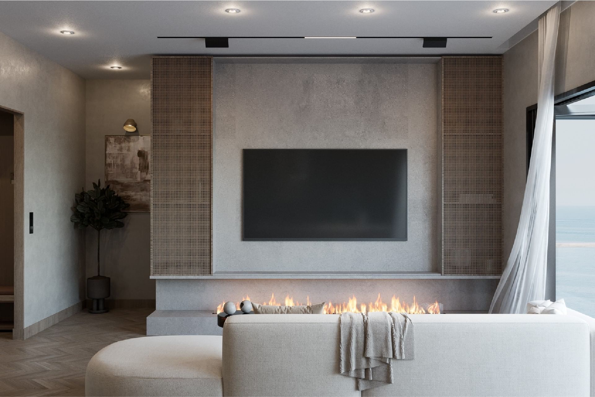 Living room with a modern fireplace, a large TV, and an elegant, minimalist design in BlueZone Residence at A'ila Residences
