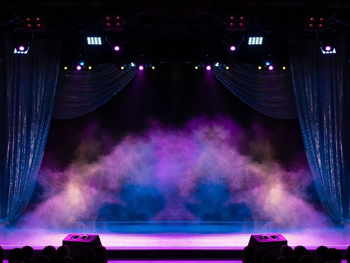 An empty stage with smoke at Grand Fiesta Americana