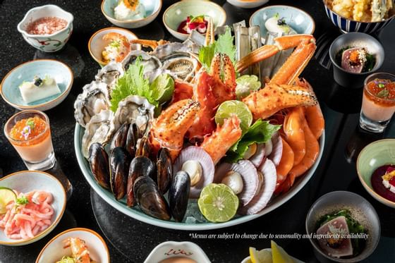 Close-up of seafood plates served in a bar at Okura Prestige