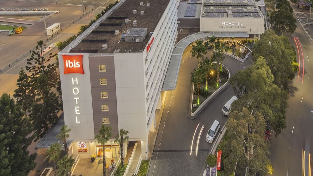 Aerial view of Novotel Sydney Olympic Park with The Driveway and surrounding greenery