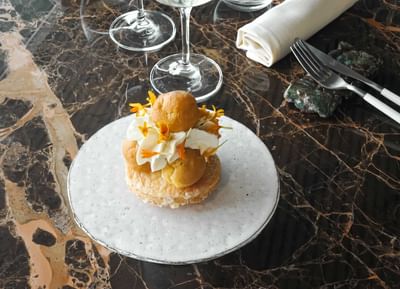 A plate with cheese burger served at Sublimis Boutique Hotel Camogli