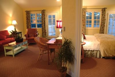 Deluxe Suite with view into living room and king bedroom