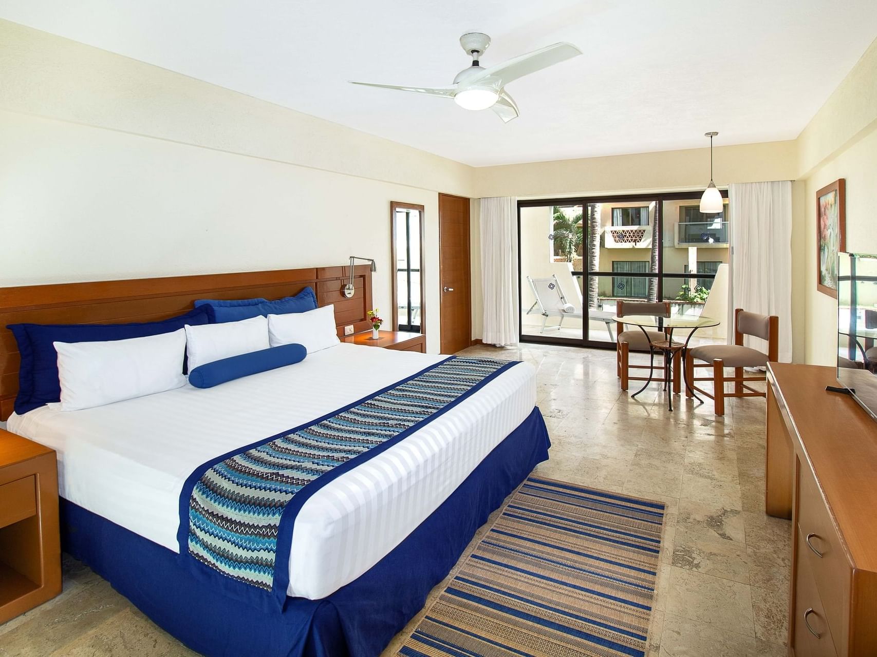 Sitting area by the king bed in 1 Bedroom Suite at Plaza Pelicanos Grand Beach Resort