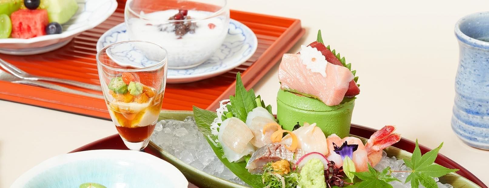 Close-up of tray displaying a traditional Japanese Kaiseki meal served at The Okura Prestige Bangkok