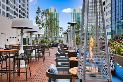 Torch Heaters by the tables in Topside Terrace Kitchen & Bar at Hotel Republic San Diego