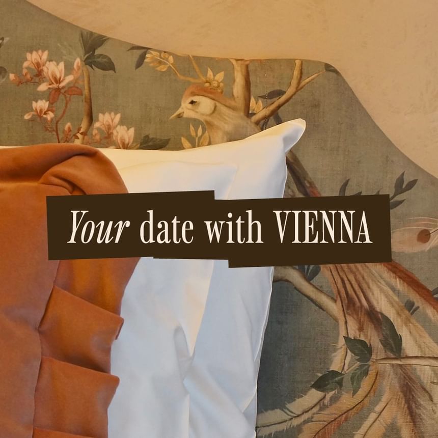 Your Date with Vienna banner featuring a beautifully styled bed with decorative pillows at Hotel Motto Vienna
