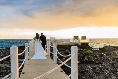 Wedded couple on a jetty at The Morgan Resort Spa Village