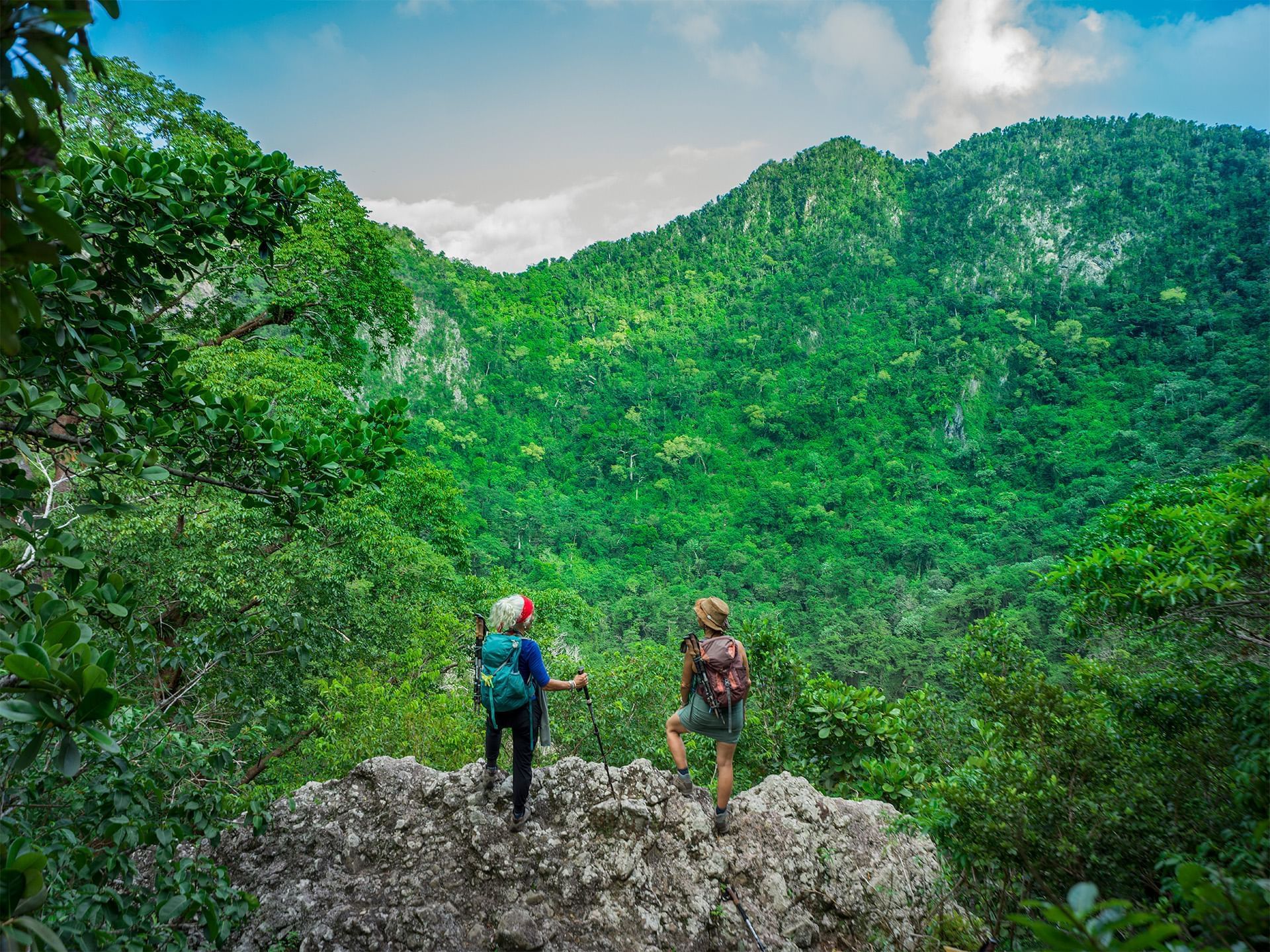 Couple mountain hiking near Golden Rock Resort