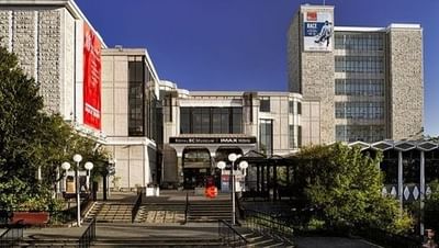 A large wide shot of the Royal BC Museum and IMAX building on a clear day near the Embassy Inn Victoria