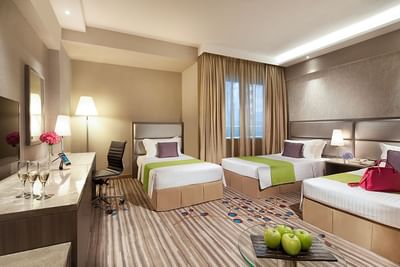 Deluxe Triple Room with cozy beds, Tv and a working area at Park Hotel Hong Kong