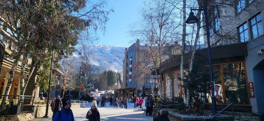 People walking through Whistler Village in March