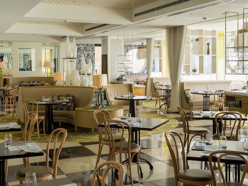 Bistro Guillaume interior with tables set for dining, natural light at Crown Metropol Perth