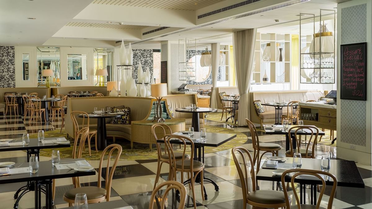 Bistro Guillaume interior with tables set for dining, natural light at Crown Metropol Perth