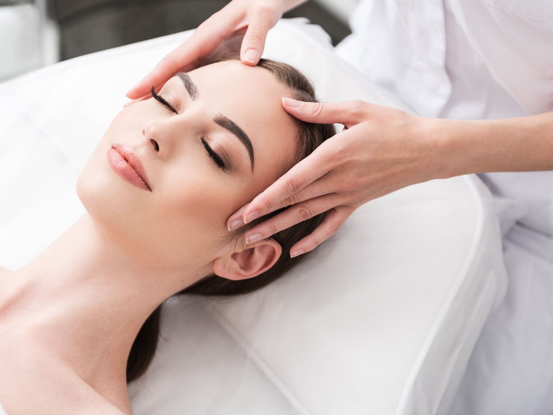 A lady getting a spa treatment, Aramsa Spa at Paradox Singapore