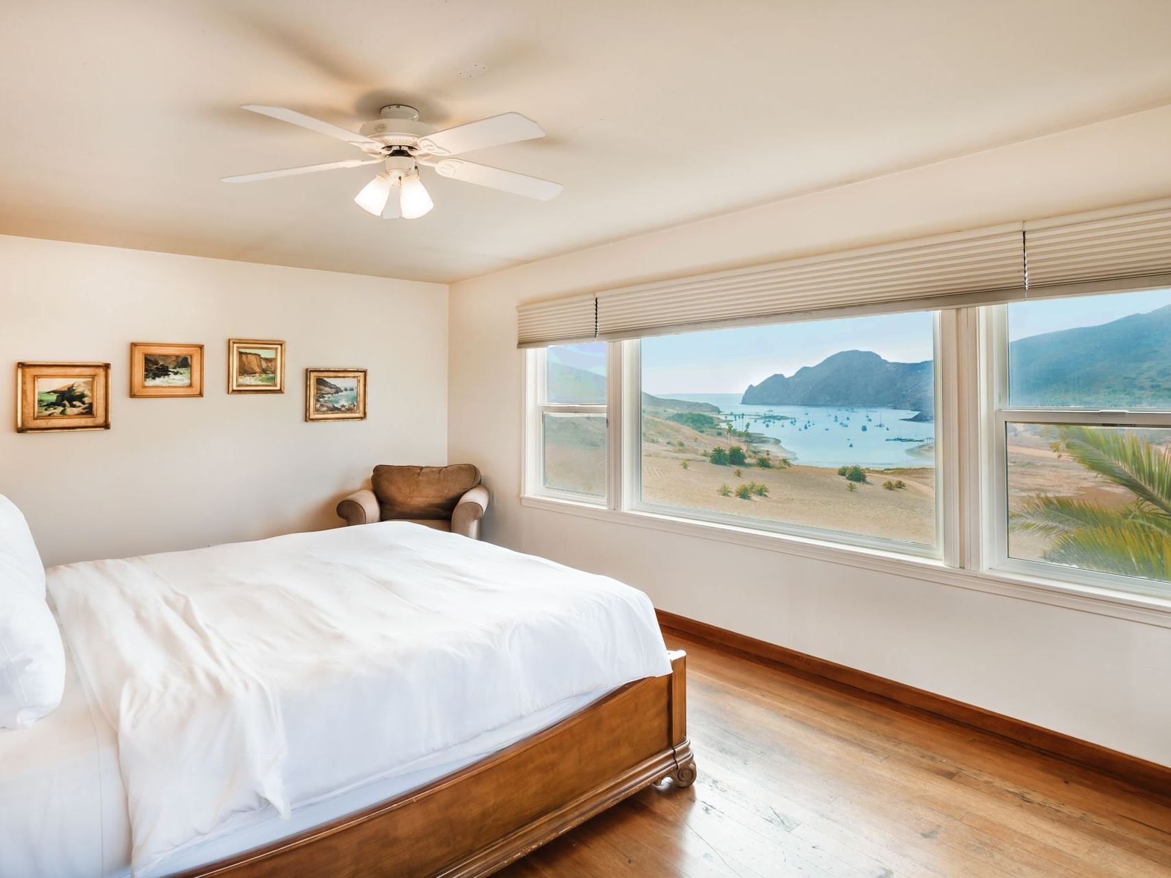 Cozy chair by king bed in Cliff House Room with the ocean view at Banning House Lodge