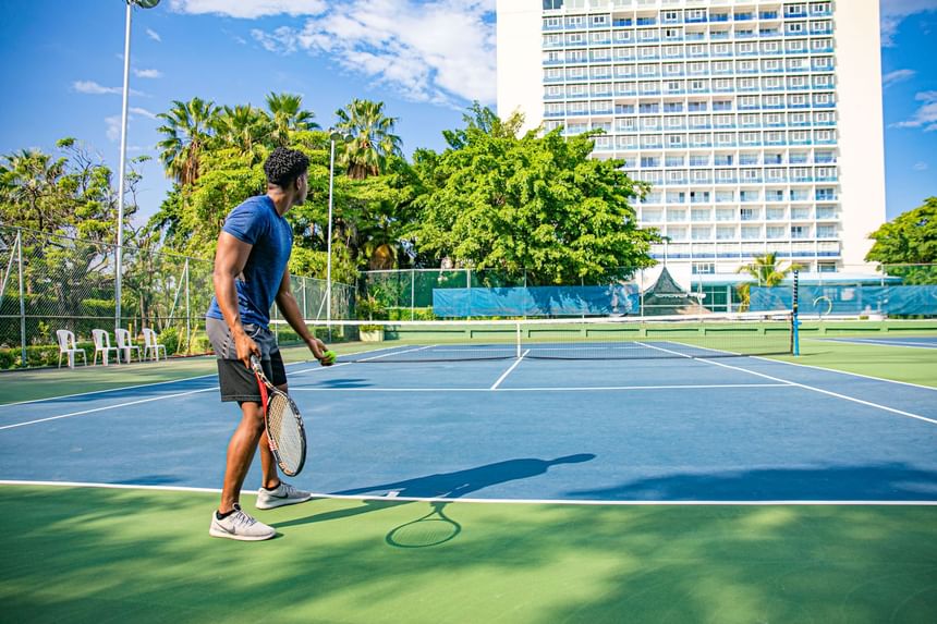 A man ready to play tennis at 
Jamaica Pegasus Hotel