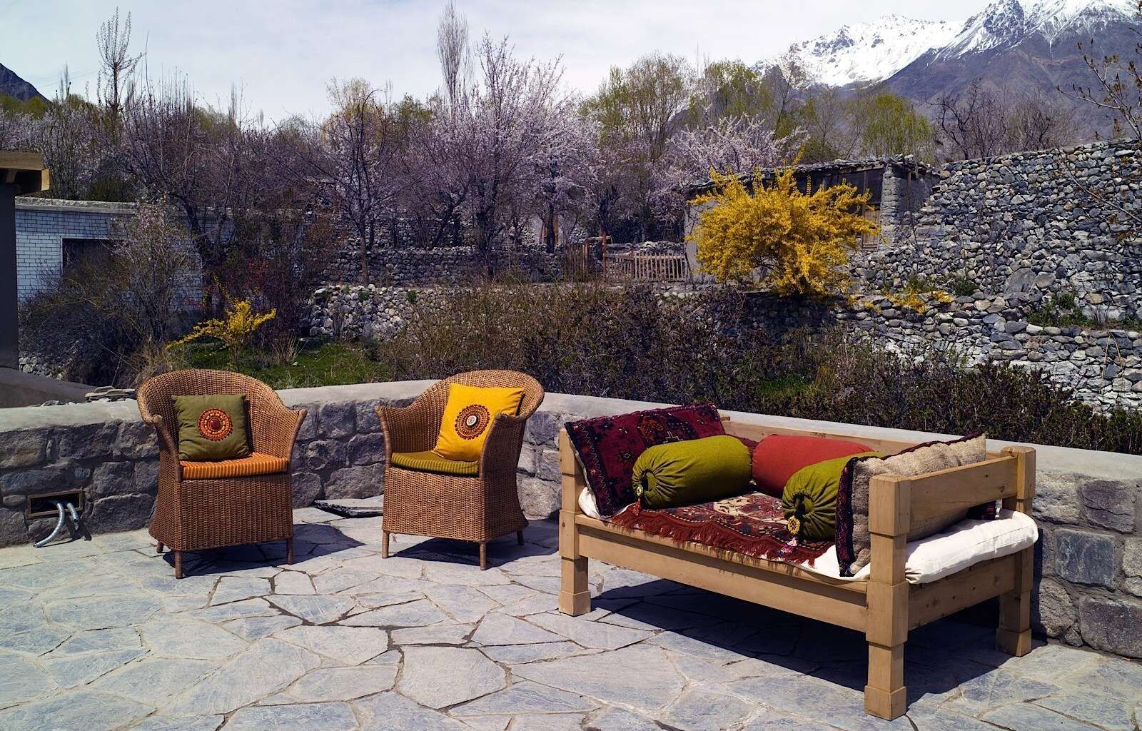 An outdoor lounge area in the hotel at Serena Khaplu Palace